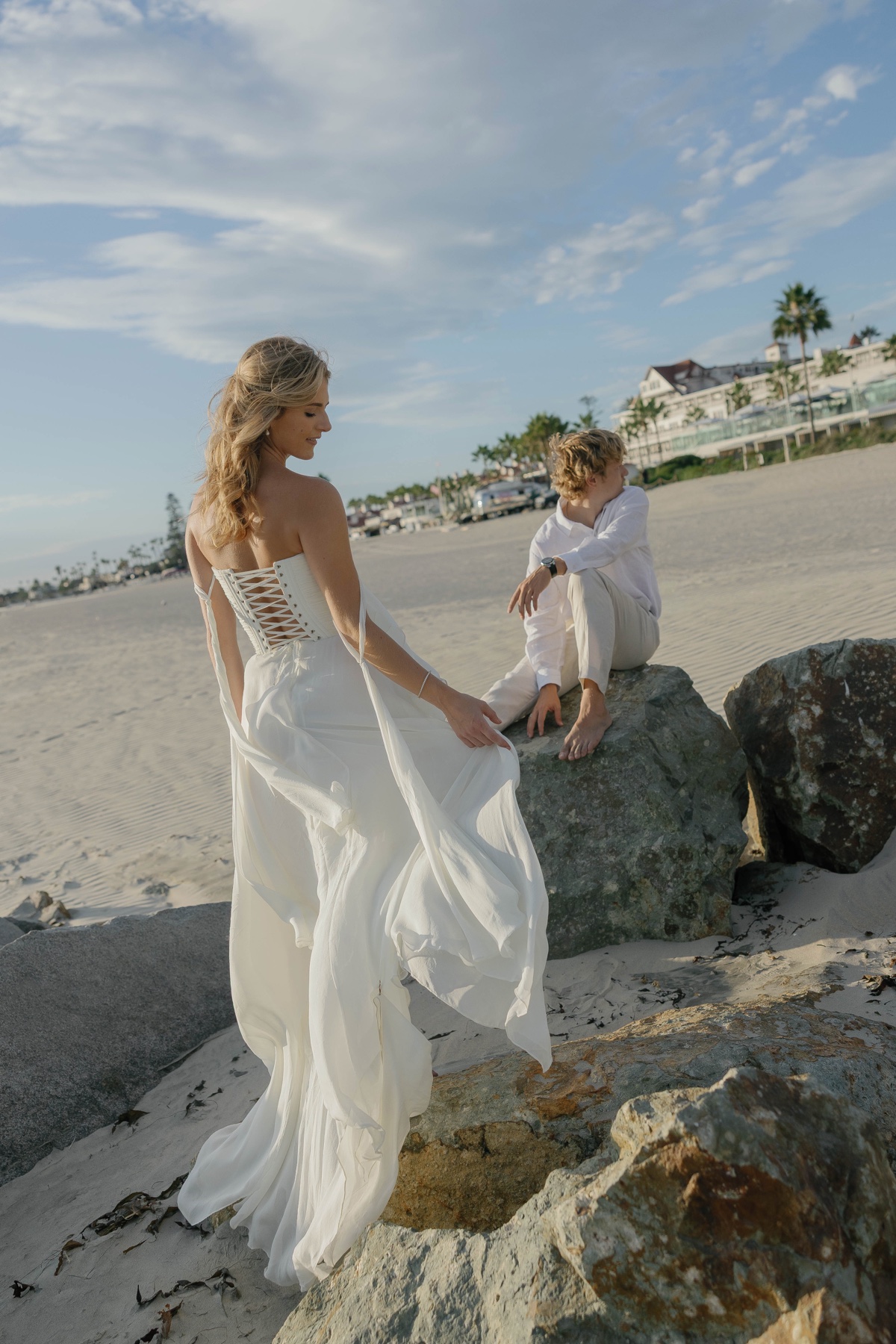 Jade walking toward Patrick on the beach