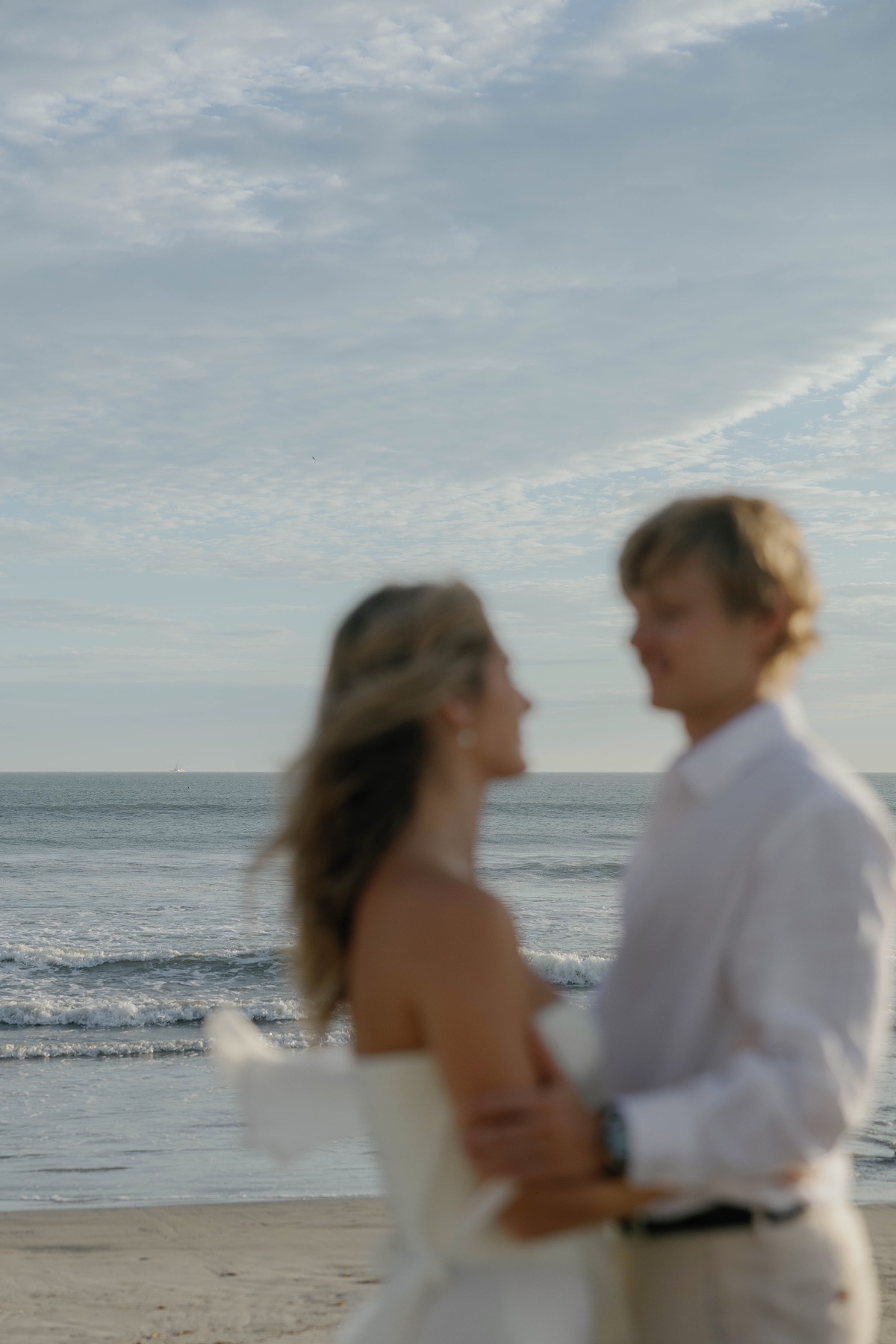 Jade and Patrick together by the ocean