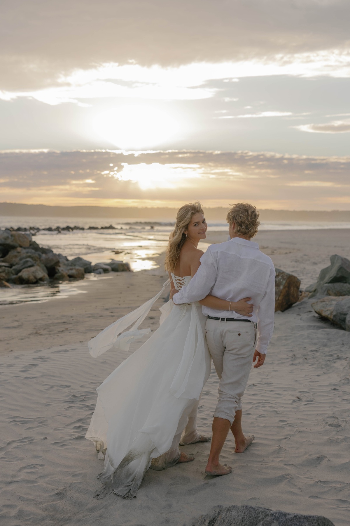 Jade and Patrick walking together at sunset